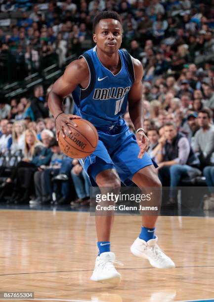 Yogi Ferrell of the Dallas Mavericks handles the ball against the Philadelphia 76ers on October 28, 2017 at the American Airlines Center in Dallas,...