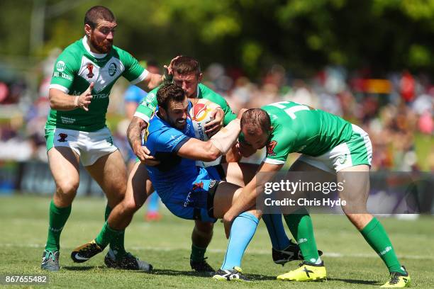 Josh Mantellato of Italy is tackled during the 2017 Rugby League World Cup match between Ireland and Italy at Barlow Park on October 29, 2017 in...