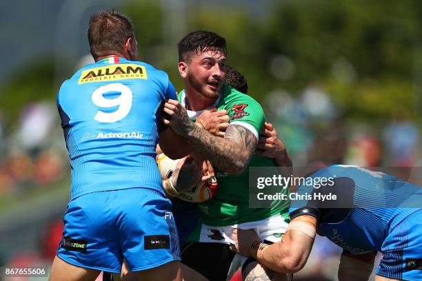 Oliver Roberts of Ireland is tackled during the 2017 Rugby League World Cup match between Ireland and Italy at Barlow Park on October 29, 2017 in...