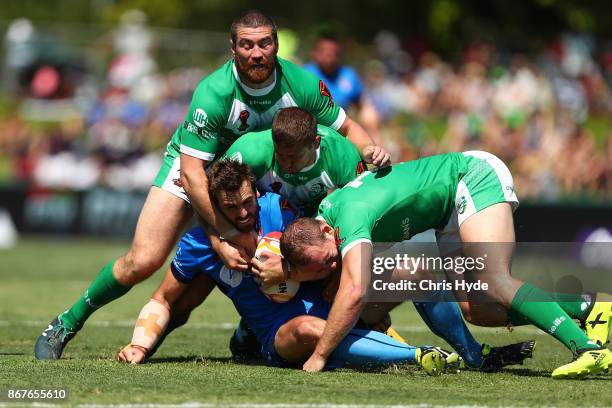 Josh Mantellato of Italy is tackled during the 2017 Rugby League World Cup match between Ireland and Italy at Barlow Park on October 29, 2017 in...