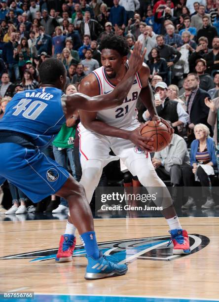 Joel Embiid of the Philadelphia 76ers handles the ball against the Dallas Mavericks on October 28, 2017 at the American Airlines Center in Dallas,...