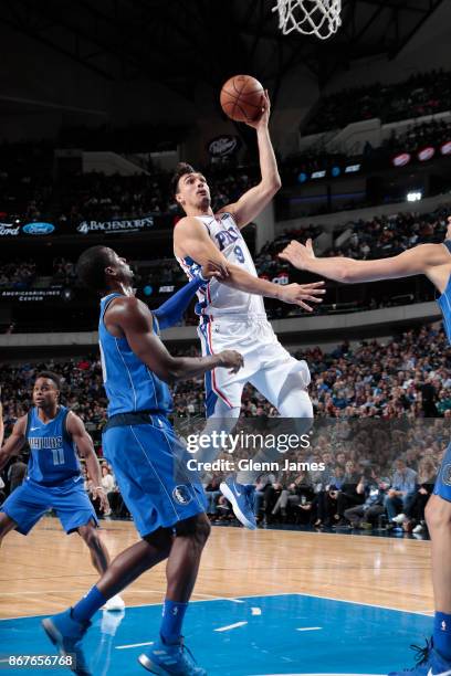 Dario Saric of the Philadelphia 76ers drives to the basket against the Dallas Mavericks on October 28, 2017 at the American Airlines Center in...