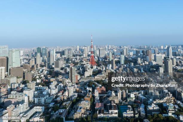 tokyo city cityscape aerial with tokyo tower and skyscrapers under a clear blue sky, taken from roppongi, minato ward, tokyo, japan. - roppongi ストックフォトと画像