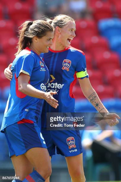 Emily Van Egmond and Katherine Stengel of the Jets celebrate a goal during the round one W-League match between the Newcastle Jets and the Western...