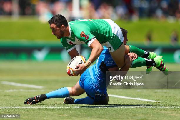 Api Pewhairangi of Ireland is tackled by Nathan Milone of Italy during the 2017 Rugby League World Cup match between Ireland and Italy at Barlow Park...