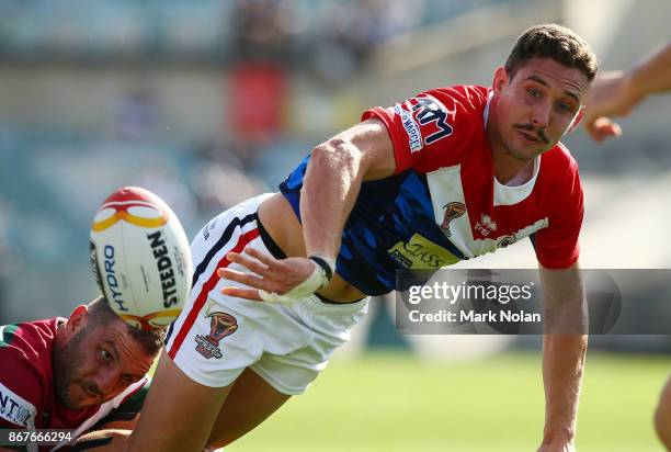 Bastien Ader of France offloads during the 2017 Rugby League World Cup match between France and Lebanon at Canberra Stadium on October 29, 2017 in...