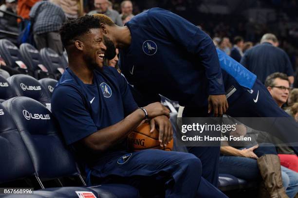 Jimmy Butler and Aaron Brooks of the Minnesota Timberwolves speak before the game against the Oklahoma City Thunder on October 27, 2017 at the Target...