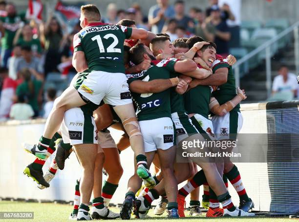 Lebanon players celebrate a try by Mitchell Moses during the 2017 Rugby League World Cup match between France and Lebanon at Canberra Stadium on...