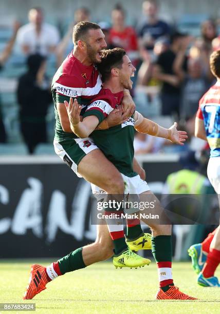 Robbie Farah and Mitchell Moses of Lebanon celebrate a try by Mitchell Moses during the 2017 Rugby League World Cup match between France and Lebanon...