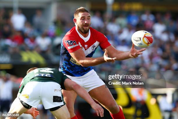 Julian Bousquet of France offloads during the 2017 Rugby League World Cup match between France and Lebanon at Canberra Stadium on October 29, 2017 in...