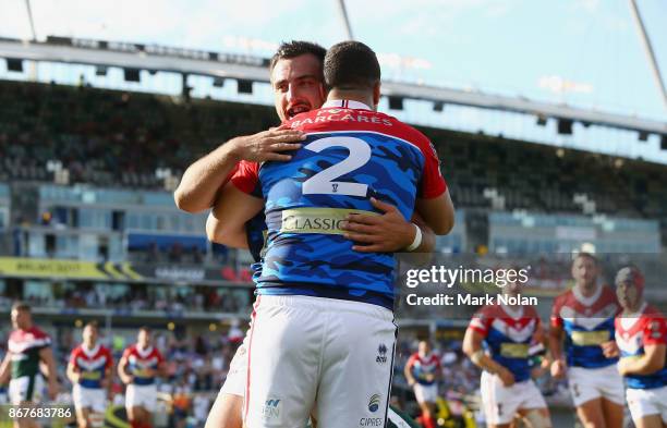 Jason Wehbe of Lebanon celebrates a try with a team mate during the 2017 Rugby League World Cup match between France and Lebanon at Canberra Stadium...