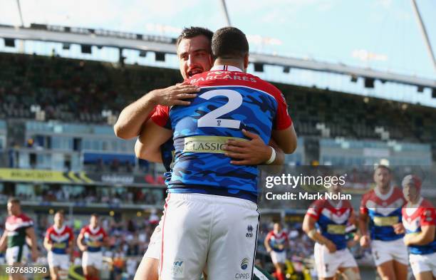 Damien Cardace of France celebrates a try with a team mate during the 2017 Rugby League World Cup match between France and Lebanon at Canberra...