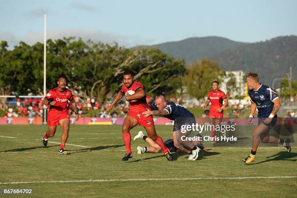 Sika Peni Terepo makes a break to score a try during the 2017 Rugby League World Cup match between Scotland and Tonga at Barlow Park on October 29,...