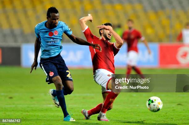 Wydad's Defnder Mouhamed Ouattara vies for the ball with Ahly's forward Oualid Azaro during the CAF Champions League final football match between...