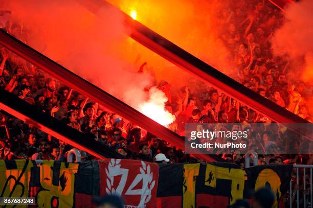 Al-Ahly supporters cheer for their team during the CAF Champions League final football match between Al-Ahly vs Wydad Casablanca at the Borg El Arab...