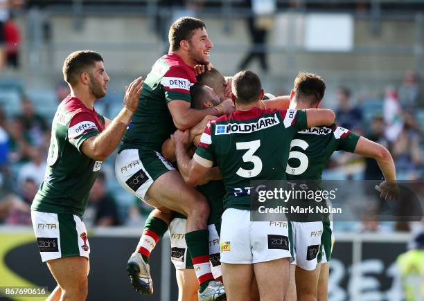 Lebanon players celebrate a try by team mate Adam Doueihi during the 2017 Rugby League World Cup match between France and Lebanon at Canberra Stadium...