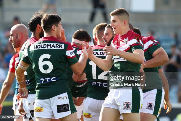 Lebanon players celebrate a try by team mate Adam Doueihi during the 2017 Rugby League World Cup match between France and Lebanon at Canberra Stadium...