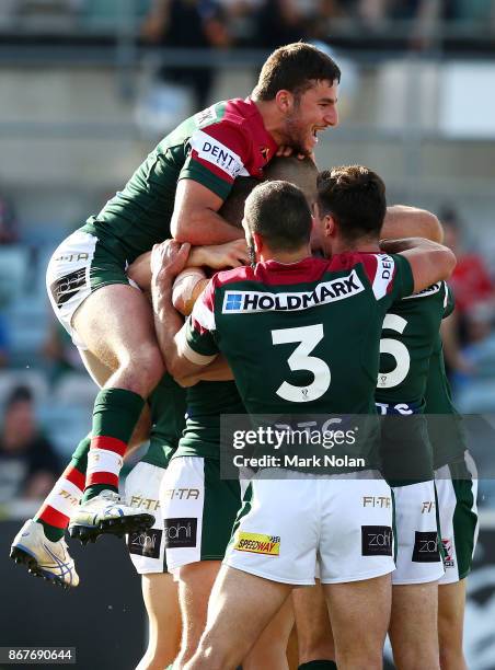 Lebanon players celebrate a try by team mate Adam Doueihi during the 2017 Rugby League World Cup match between France and Lebanon at Canberra Stadium...