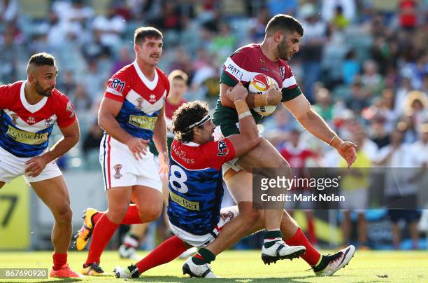Alex Twal of Lebanon is tackled during the 2017 Rugby League World Cup match between France and Lebanon at Canberra Stadium on October 29, 2017 in...