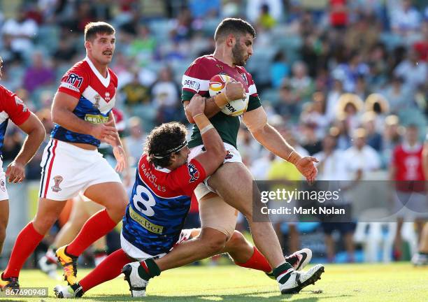 Alex Twal of Lebanon is tackled during the 2017 Rugby League World Cup match between France and Lebanon at Canberra Stadium on October 29, 2017 in...