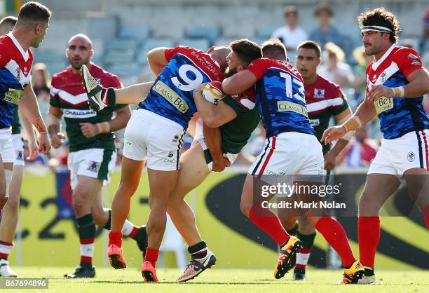 Abbas Miski of Lebanon is tackled during the 2017 Rugby League World Cup match between France and Lebanon at Canberra Stadium on October 29, 2017 in...