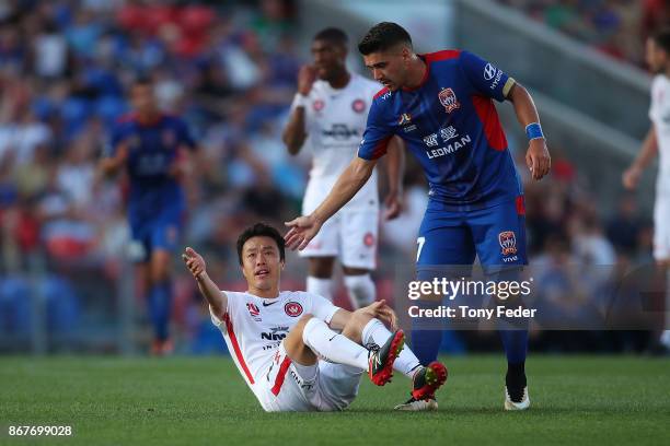 Dimitri Petratos of the Jets with Jumpei Kusukami of the Wanderers during the round four A-League match between the Newcastle Jets and the Western...
