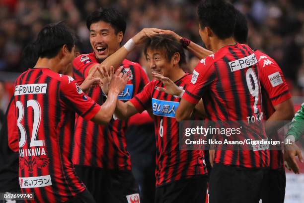 Shingo Hyodo of Consadole Sapporo celebrates scoring his side's first goal with his team mates during the J.League J1 match between Consadole Sapporo...