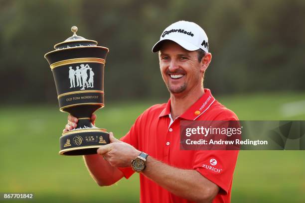 Justin Rose of England celebrates with the Old Tom Morris Cup after finishing 14 under to win the WGC - HSBC Champions at Sheshan International Golf...