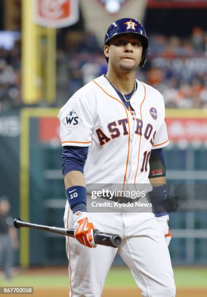 Houston Astros infielder Yulieski Gurriel walks back to the bench after striking out in the fifth inning of Game 4 of the World Series against the...