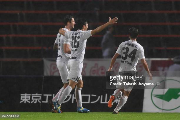 Mike Havenaar of Vissel Kobe celebrates scoring his side's third goal with his team mates Hideto Takahashi and So Fujitani during the J.League J1...