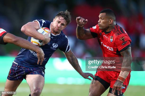 Ben Hellewell of Scotland is tackled during the 2017 Rugby League World Cup match between Scotland and Tonga at Barlow Park on October 29, 2017 in...