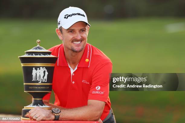 Justin Rose of England celebrates with the Old Tom Morris Cup after finishing 14 under to win the WGC - HSBC Champions at Sheshan International Golf...