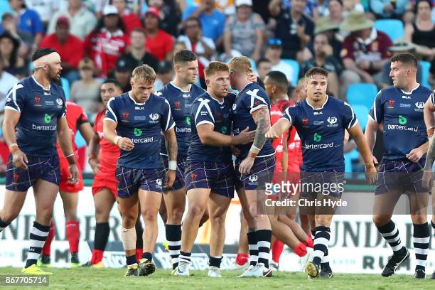 Scotland celebrate a try during the 2017 Rugby League World Cup match between Scotland and Tonga at Barlow Park on October 29, 2017 in Cairns,...