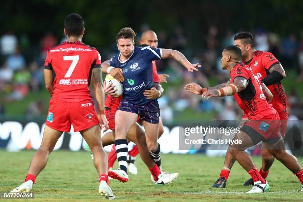 Ben Hellewell of Scotland is tackled during the 2017 Rugby League World Cup match between Scotland and Tonga at Barlow Park on October 29, 2017 in...