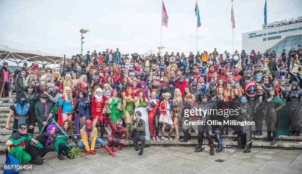 Cosplayers in character as characters from Marvel and DC comics including Harley Quinn, Batman, Spiderman, Superman, Poison Iy, Captain America,...