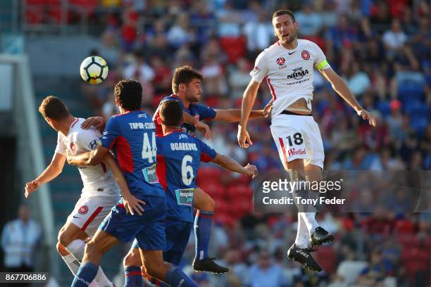 Robert Cornthwaite of the Wanderers contests a header during the round four A-League match between the Newcastle Jets and the Western Sydney...