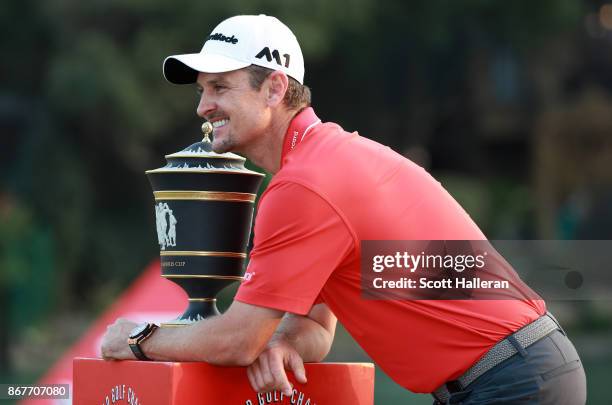 Justin Rose of England celebrates with the Old Tom Morris Cup after finishing 14 under to win the WGC - HSBC Champions at Sheshan International Golf...