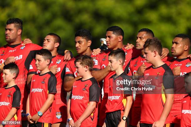 Tonga line up for the national anthem during the 2017 Rugby League World Cup match between Scotland and Tonga at Barlow Park on October 29, 2017 in...