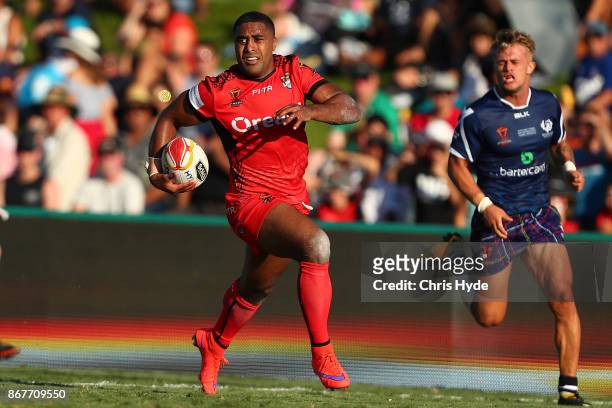Michael Jennings of Tonga makes a break to score a try during the 2017 Rugby League World Cup match between Scotland and Tonga at Barlow Park on...