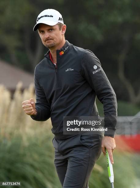 Justin Rose of England celebrates on the 18th green during the final round of the WGC - HSBC Champions at Sheshan International Golf Club on October...