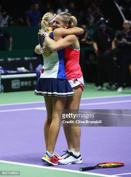 Timea Babos of Hungary and Andrea Hlavackova of Czech Republic celebrate victory in the Doubles Final against Johanna Larsson of Sweden and Kiki...