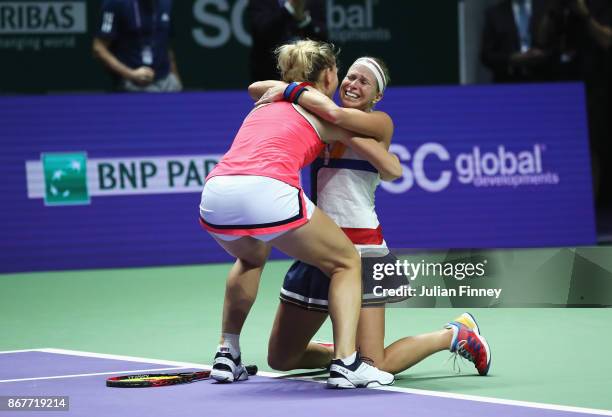 Timea Babos of Hungary and Andrea Hlavackova of Czech Republic celebrate victory in the Doubles Final against Johanna Larsson of Sweden and Kiki...