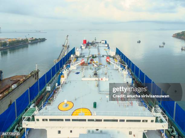 aerial view shipyard have crane machine and container ship in green sea . - elemento vasale foto e immagini stock