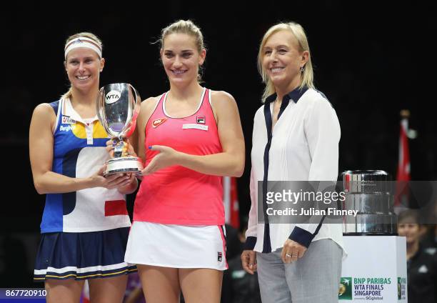 Andrea Hlavackova of Czech Republic and Timea Babos of Hungary pose with the Martina Navratilova trophy after victory in the Doubles Final against...