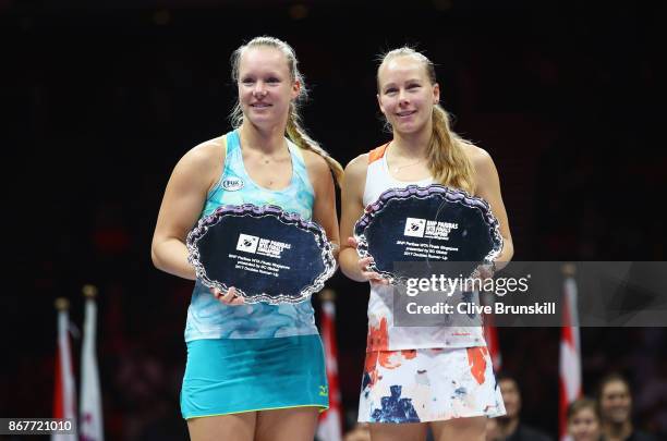 Kiki Bertens of Netherlands and Johanna Larsson of Sweden pose with their runners up trophies after the Doubles Final against Andrea Hlavackova of...