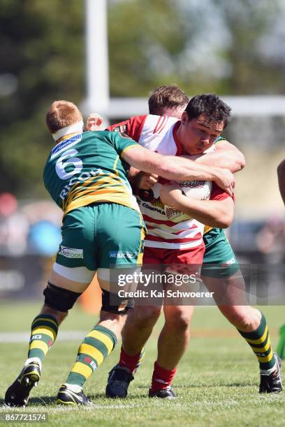 Brad Tauwhare of West Coast is tackled during the Mitre 10 Heartland Championship Lochore Cup Final match between Mid Canterbury and West Coast on...