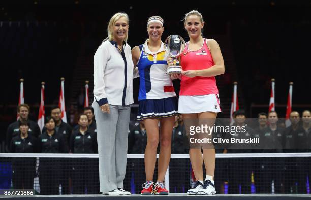 Andrea Hlavackova of Czech Republic and Timea Babos of Hungary pose with the Martina Navratilova trophy after victory in the Doubles Final against...