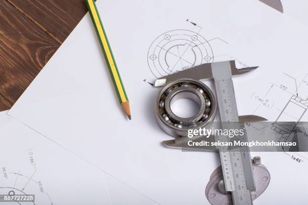 tools and mechanisms detail on the background of technical drawings - calibrador fotografías e imágenes de stock