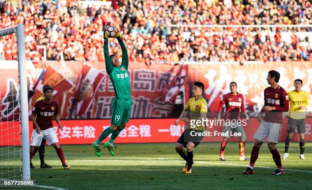 Yang Cheng of Hebei China Fortune makes a finger-tip save during the Chinese Super League match between Hebei China Fortune and Guangzhou Evergrande...