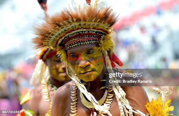 Papua New Guinean dancers perform a traditional dance before the Rugby League World Cup match between Papua New Guinea and Wales at Oil Search...